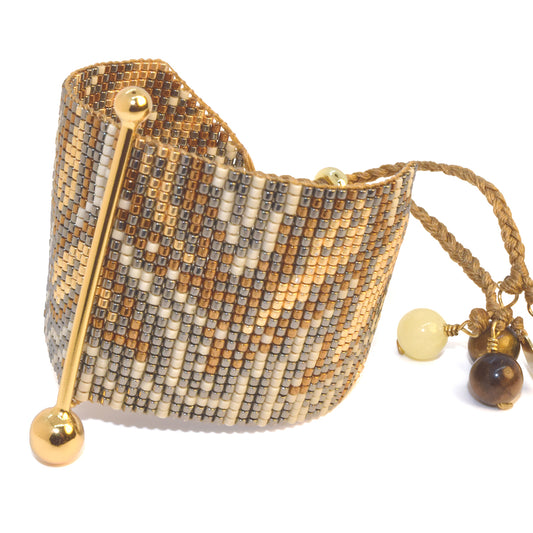 FINE ART BRACELET IN GOLD, BRONZE, GUNMETAL AND PEARL