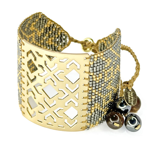 Murat Bracelet detail - Gold & pewter Miyuki beadwork geometric lattice - Martha Duran Design
Murat Cuff - Tiger's eye stones & gold clasp - Handcrafted in Colombia
Murat Bracelet side view - Gunmetal gold palette - Martha Duran Design
